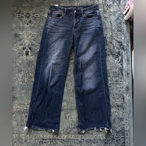 Low rise baggy wide leg jeans with distressed hem